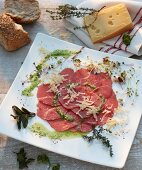 Beef carpaccio with walnut oil and grated mountain cheese