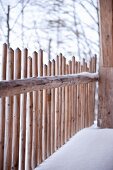 Wooden fence in winter atmosphere