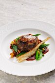 Stuffed oxtail with chanterelle mushrooms and peas