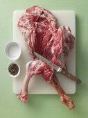 A leg of lamb being deboned