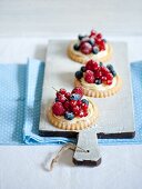 Mixed berry tarts with vanilla cream