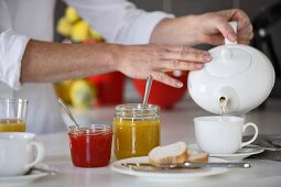 Breakfast with jam, bread and tea