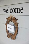 Welcome wreath with angel motif on door