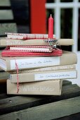 Stack of books and red candle