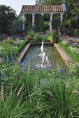 Garden with pool in front of pavilion in Ancient Greek style