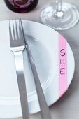 An alternative to place cards: patterned masking tape on the dinner plate, with the name written on
