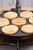 Pancakes being baked in a pancake pan