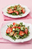 Rocket and strawberry salad with feta cheese, chicken and walnuts