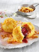 Damson dumplings with butter crumbs