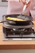 An omelette being made in a pan