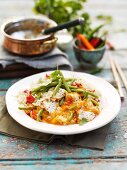 Red Thai curry with chicken and beans on a bed of fragrant rice