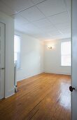 Empty room in apartment with hardwood floor