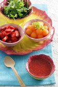 Ingredients for strawberry and melon salad with strawberry dressing