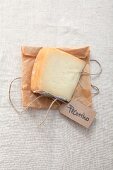 A slice of pecorino with a label