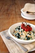 Spinach, gorgonzola and pine nut risotto topped with oven roasted cherry tomatoes