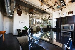 An island counter in a kitchen with a sink