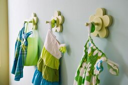 Little girl's dresses hanging on hook