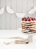 Tres Leches cake with meringue and strawberries