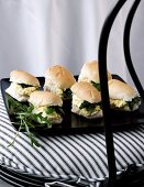 Mini bread rolls filled with scrambled egg and watercress