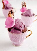 Teacups of berry ice cream with biscotti