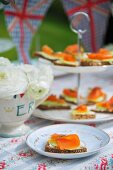 Canapes with smoked salmon and cucumber for a Jubilee party (England)