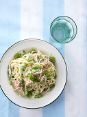 Spaghetti with salmon, asparagus and broad beans (view from above)