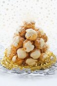 Croquembouche (Christmas dessert, France) with Christmas cake