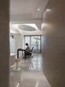 Woman working at desk in modern home