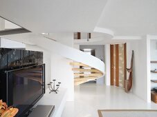 Modern winding staircase and television