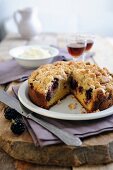 Crumble cake with blackberries and apples, sliced