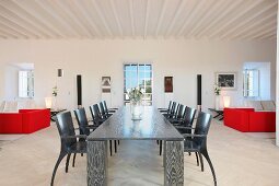 Black dining table in modern white interior