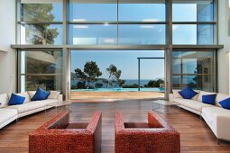 Modern living room with floor to ceiling windows