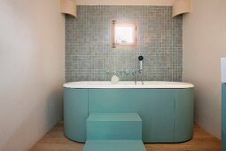 Steps leading to freestanding bathtub