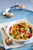 Mixed vegetable risotto with sweet bell peppers, aubergines, courgettes and parsley