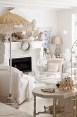 White living room with fireplace and collection of sculptures