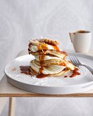 Plate of coconut pancakes with cream