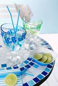 Printed cocktail glasses and dish on mosaic table