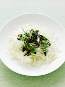 Plate of onions, olives and herbs