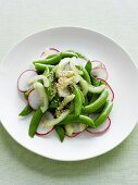 Plate of radish and snow pea salad