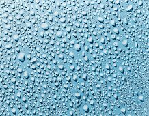 Water droplets on a blue surface