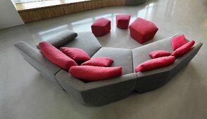 Modern gray sofa with pink throw pillows