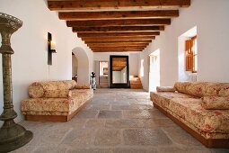 Entrance hall with stone tile and wooden ceiling beams