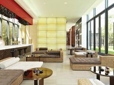 Wicker furniture in large modern sunroom lounge