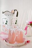 Homemade rhubarb lemonade in small bottles