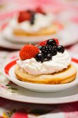 Pancake with berries and whipped cream