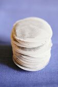 A stack of round tea bags