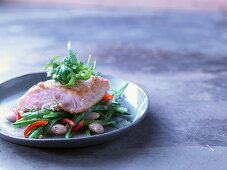 Salmon with panko flour on a bean salad