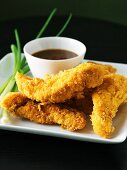 Pieces of Fried Chicken with Dipping Sauce