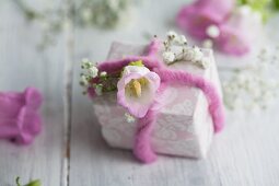 Small present with Baby's Breath, Bell Flowers and lavender felt ribbon