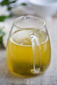 Green tea in a small glass jug